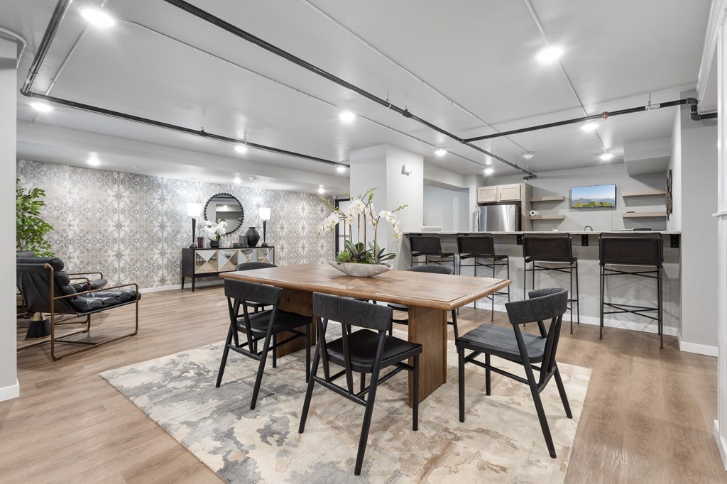 Common Room with Tables, Chairs, and Decor