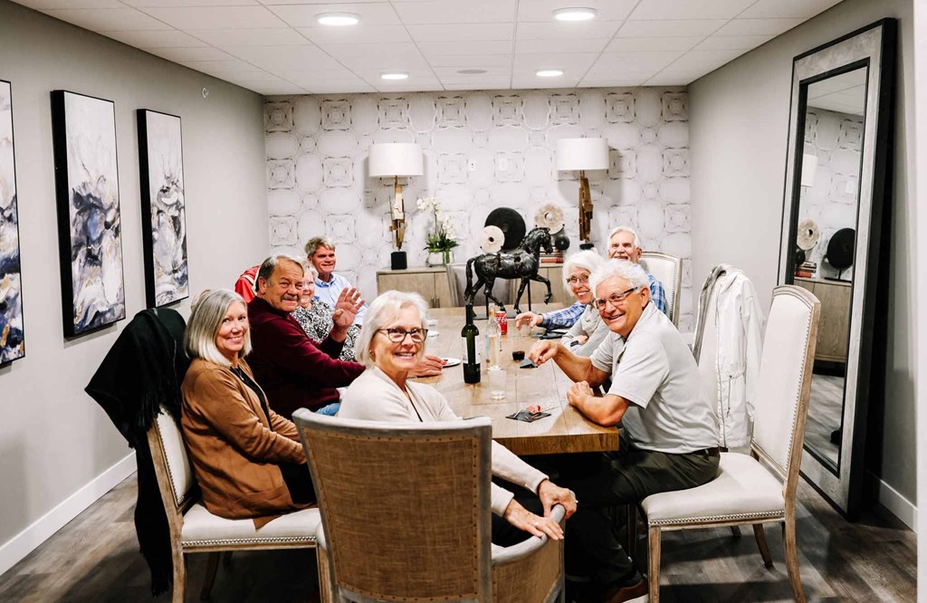 People Smiling at Table