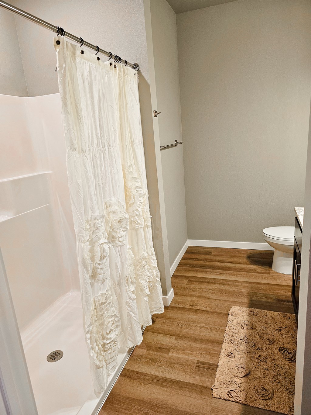 a bathroom with a shower curtain and a toilet