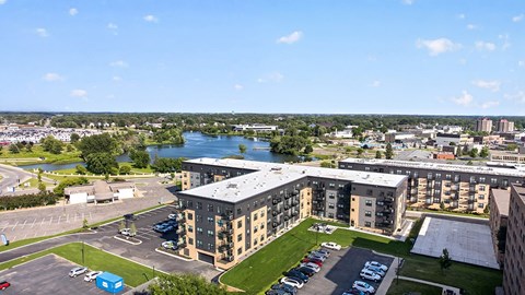 A large building with a parking lot in front of it.