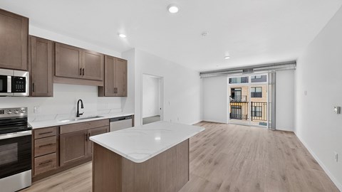 A kitchen with brown cabinets and a white countertop.