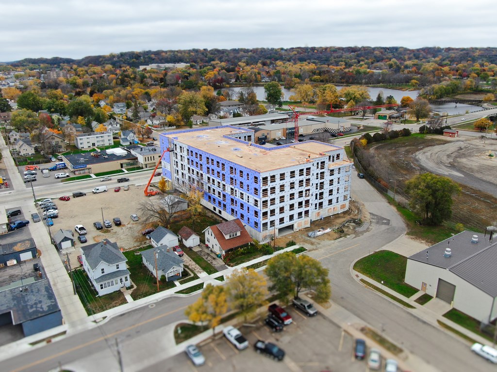 an aerial view of an apartment building in a city