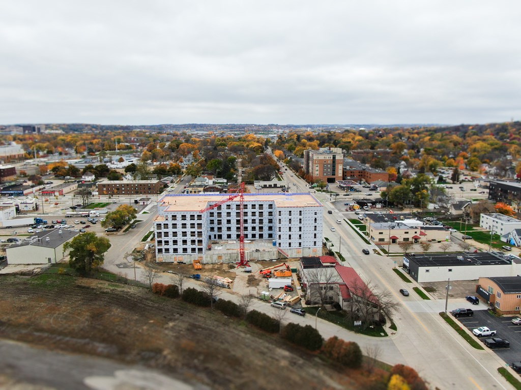 an aerial view of a city with buildings and trees