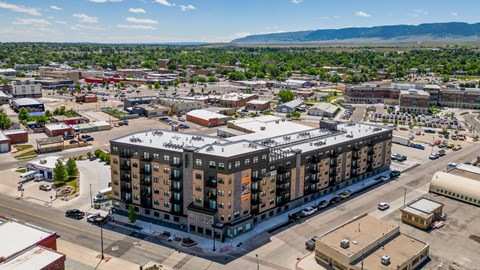 A large building with a parking lot in front of it.