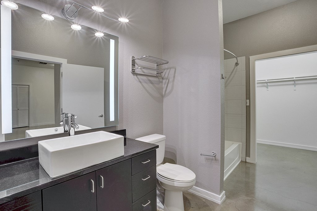 Upscale Apartment Bathroom with Black granite countertops at The Mosaic on Broadway, San Antonio, TX, 78215