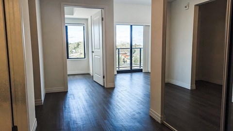 A room with wooden floors and white walls.