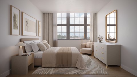 A bedroom with a large bed and a window overlooking the city.