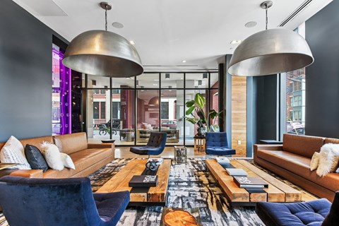 A modern living room with a large sectional sofa and a coffee table.