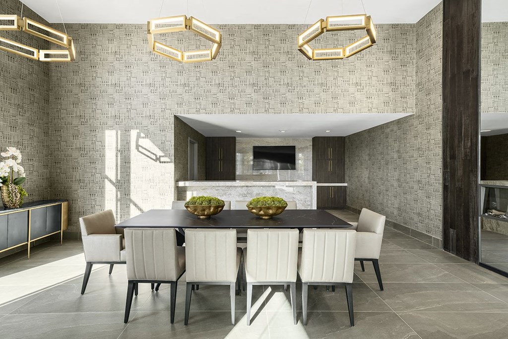Interior photo of the reservable private dining area, complete with large table with seating for 10, and private kitchen area.