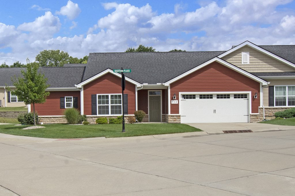 a red house with a white garage door