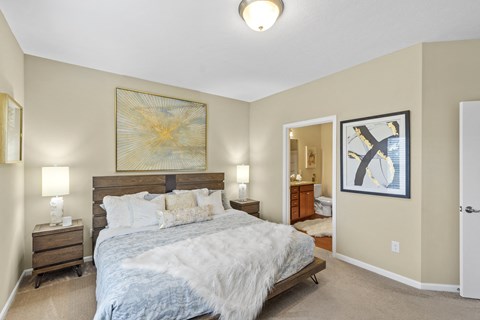 Large master bedroom with bathroom in ranch-style apartment rentals in Florence, KY