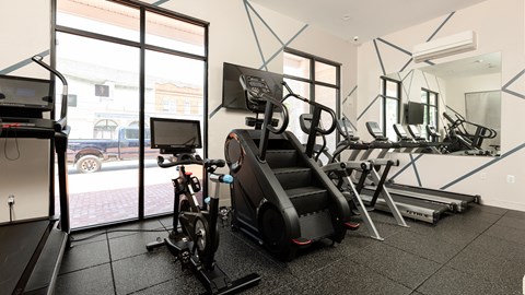 Contemporary resident gym at Bridgepoint at Bayonne with high-end equipment and bright interiors