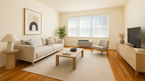 A living room with a couch, chair, and television.