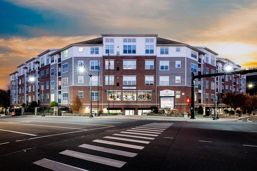 a building on the corner of a street at night