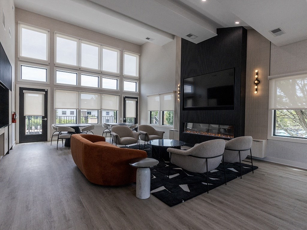 a large living room with a fireplace and a television