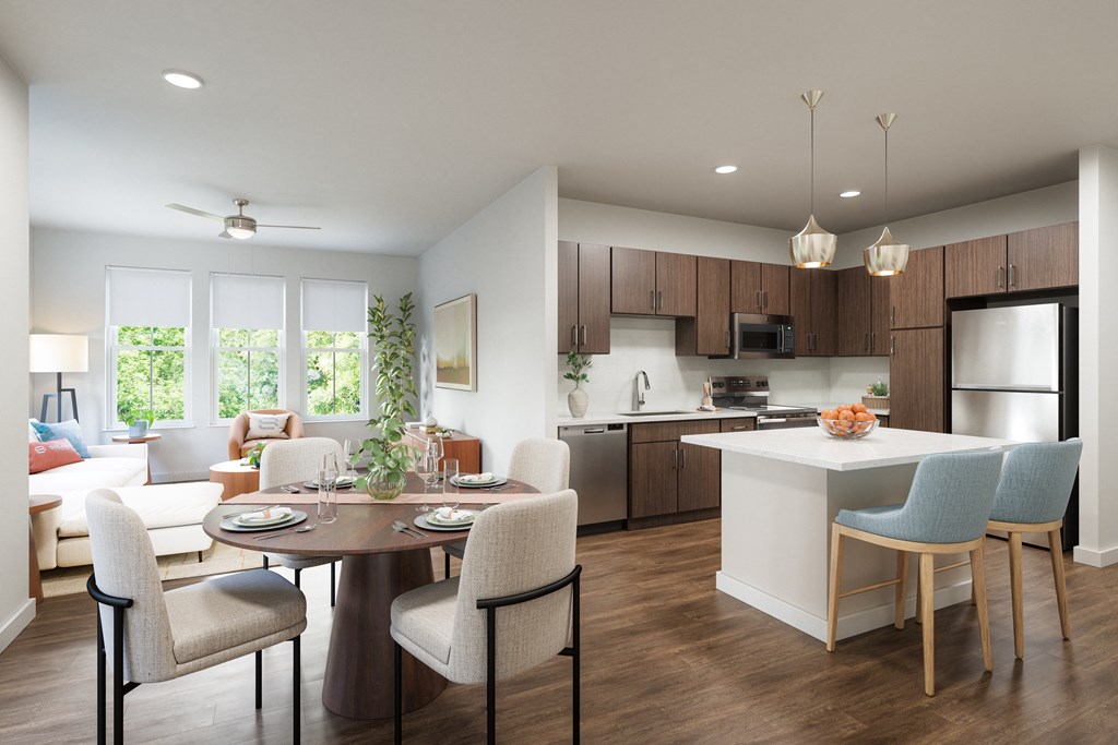 A modern kitchen with a dining table set for four.