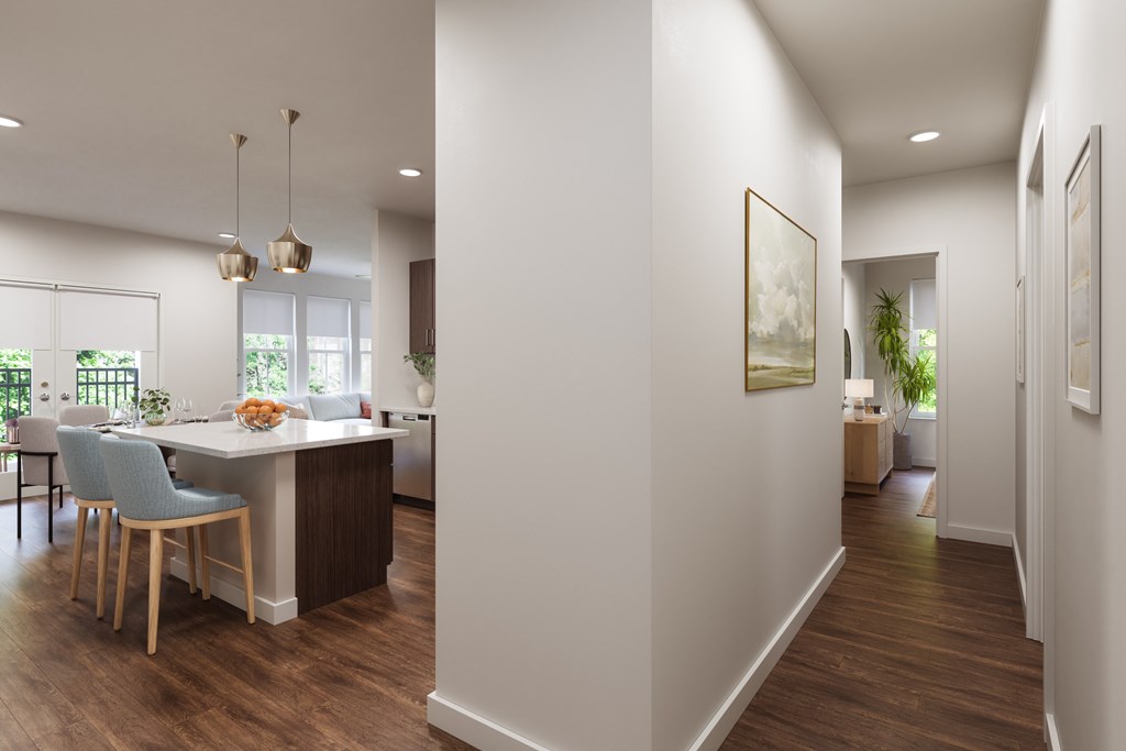 A modern kitchen with a dining table and chairs.