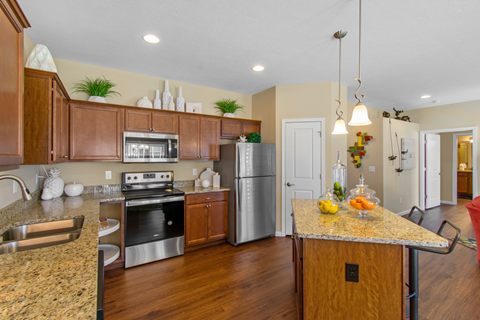 a kitchen with stainless steel appliances and granite counter tops
