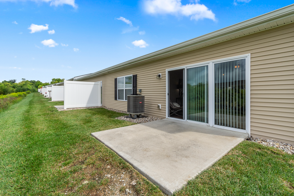 the outside of a home with a patio and a driveway