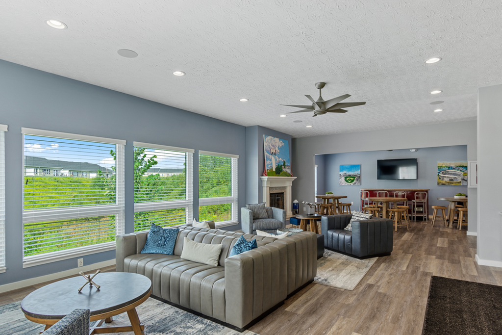 a living room with couches and chairs and a table