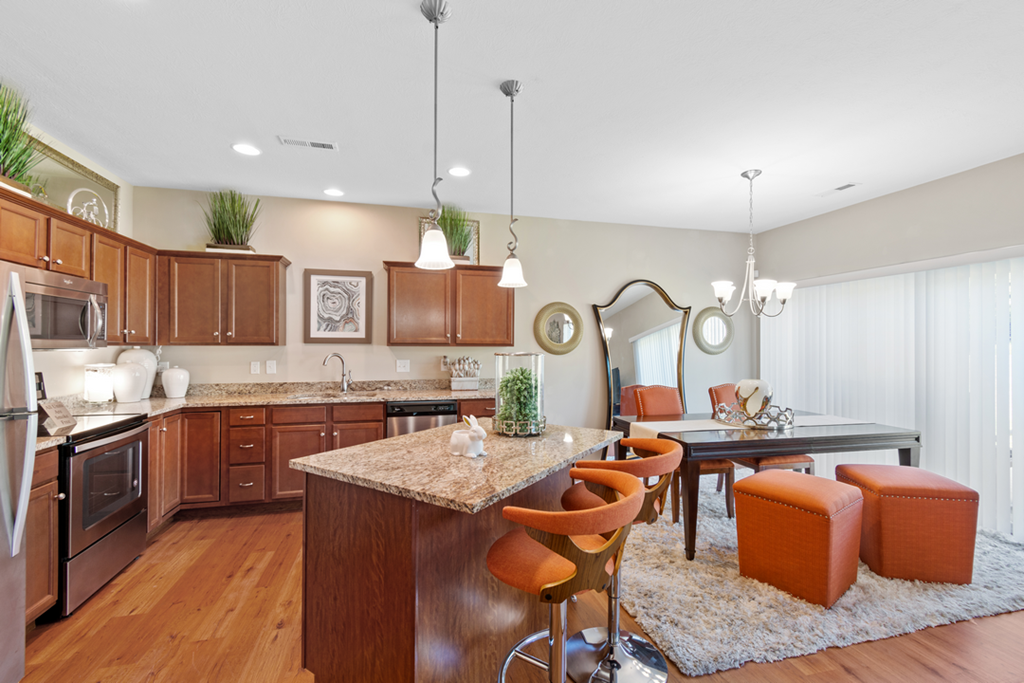 an open kitchen and dining room with a table and chairs