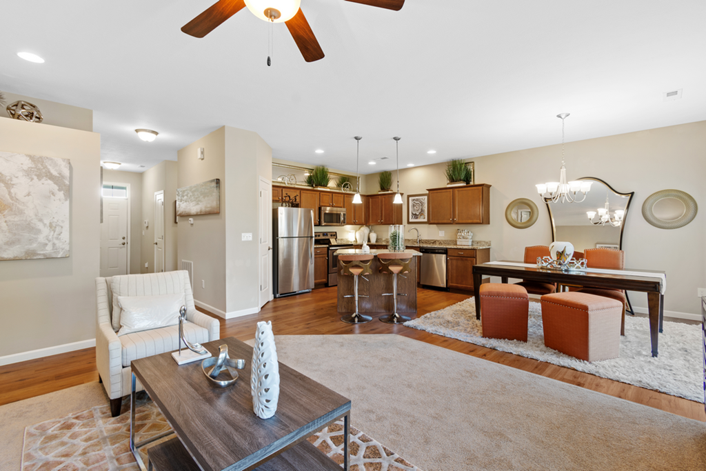 a living room with a dining room and a kitchen