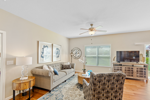 a living room with a couch and a tv