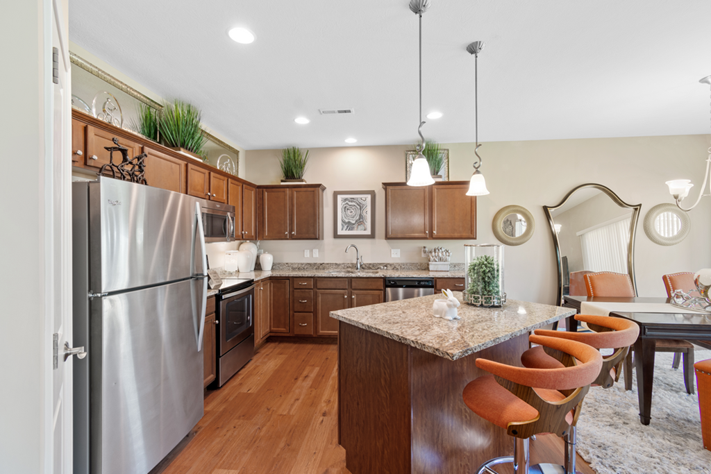 a kitchen with stainless steel appliances and a granite counter top