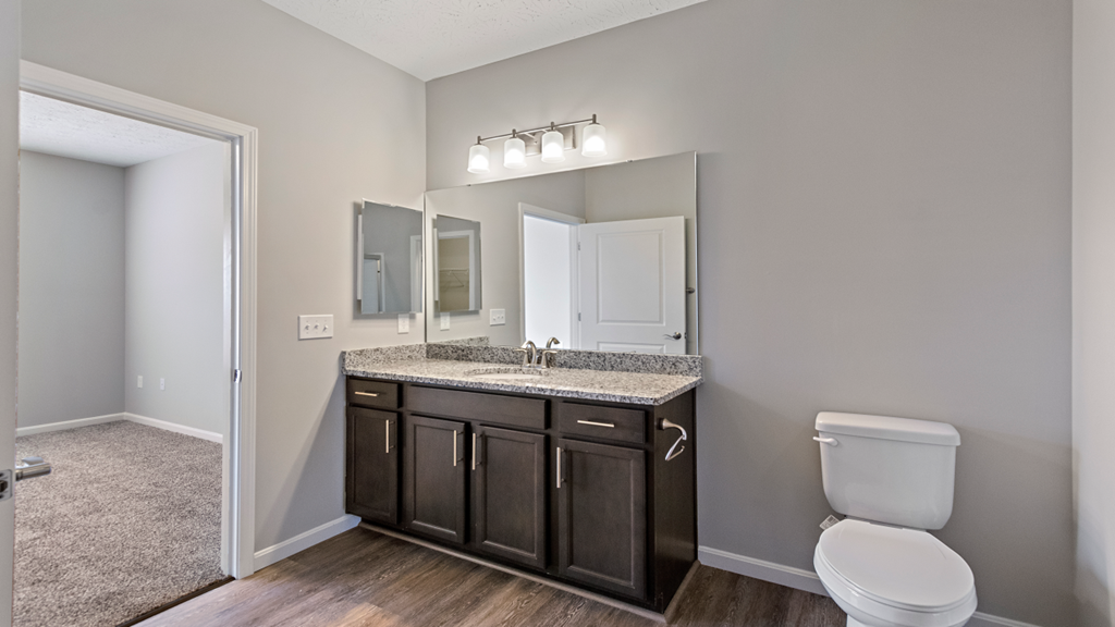an empty bathroom with a toilet and a sink