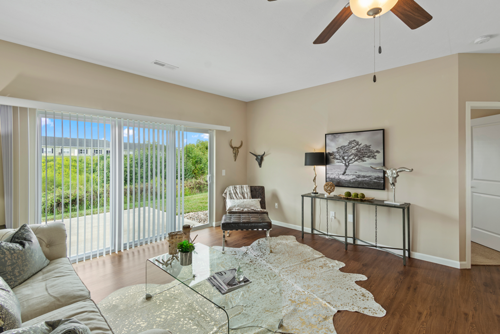 a living room with a couch and a glass coffee table
