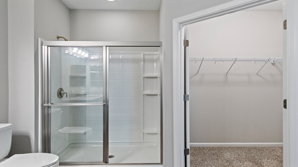 a bathroom with a shower and a toilet