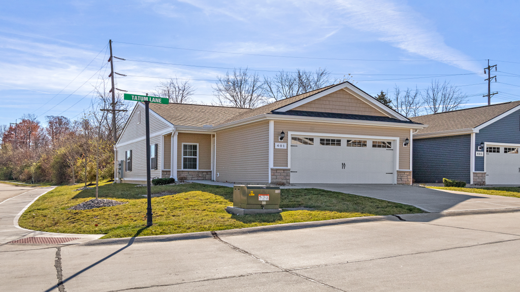 a house with a street sign in front of it