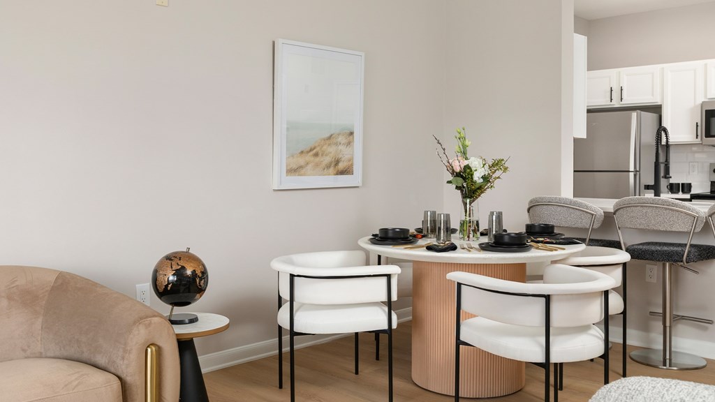Elegant dining area in a newly renovated apartment at The Mews at Princeton Junction, Princeton, NJ, with contemporary furnishings and an open-concept design