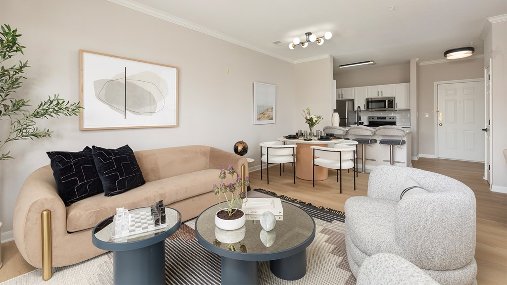 Modern 2025 newly renovated apartment living room at The Mews at Princeton Junction, featuring stylish furniture, large windows, and natural light in a spacious rental home