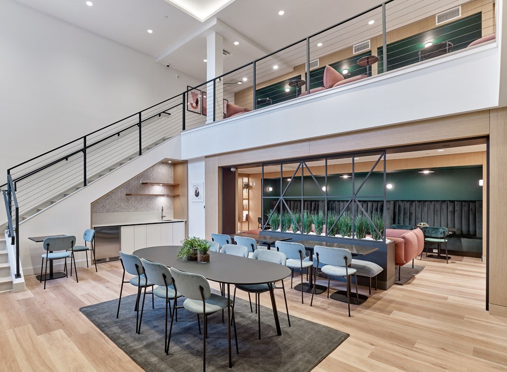 a large dining room with a table and chairs