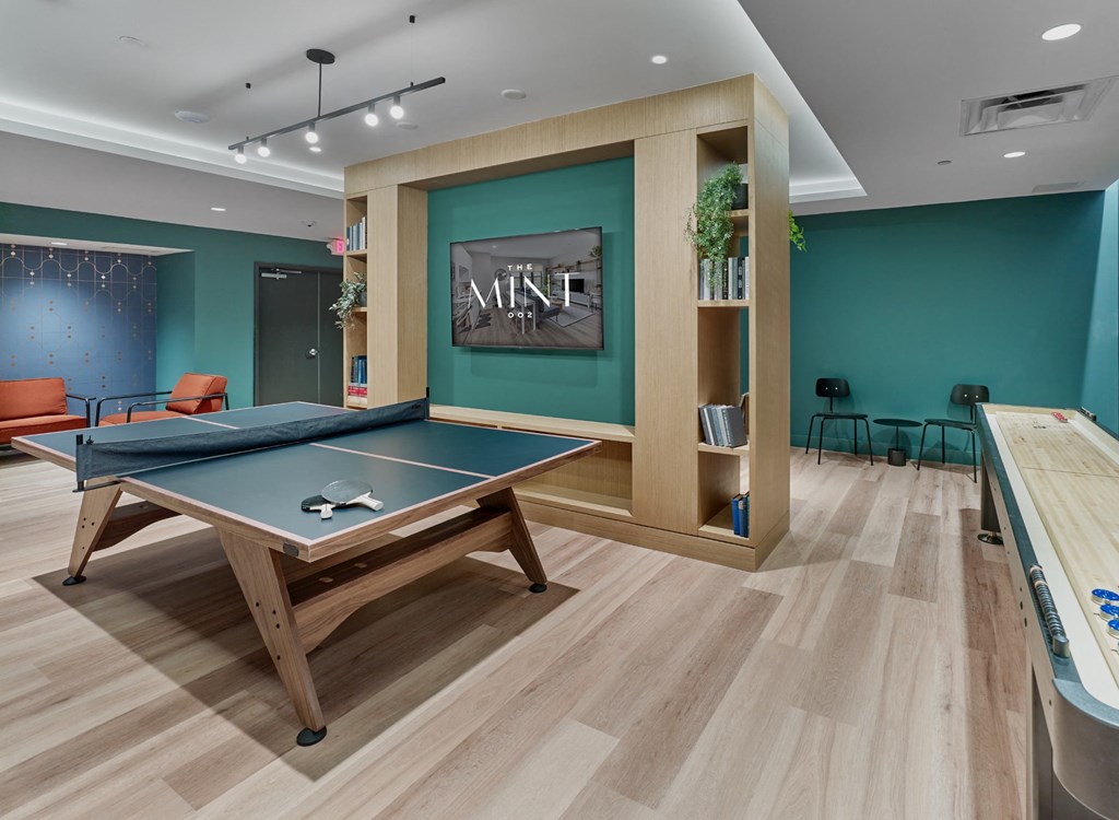 a games room with a ping pong table