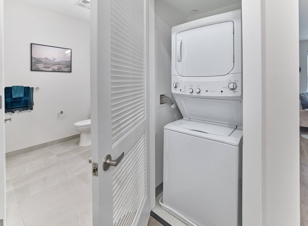 a small laundry room with a washer and dryer in it