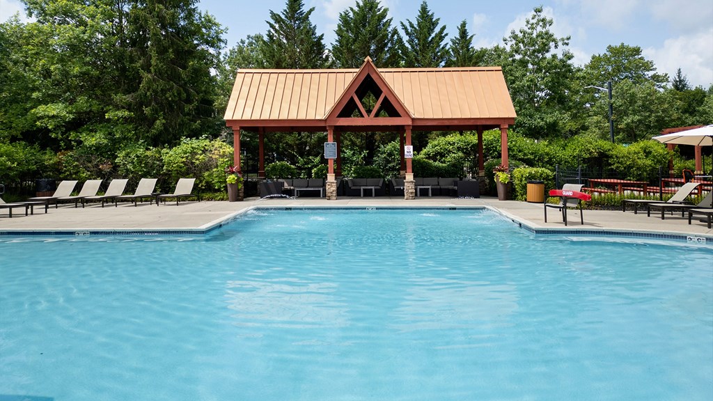 Pristine swimming pool and shaded cabana at apartments for rent in Princeton NJ