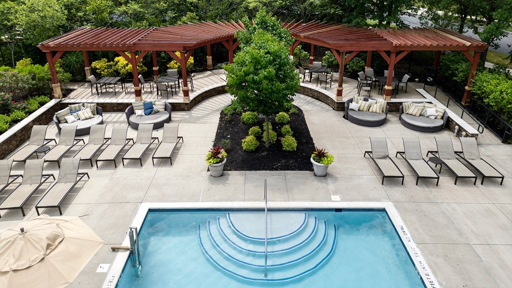Outdoor lounge and shaded pergola area at upscale Princeton NJ apartment complex