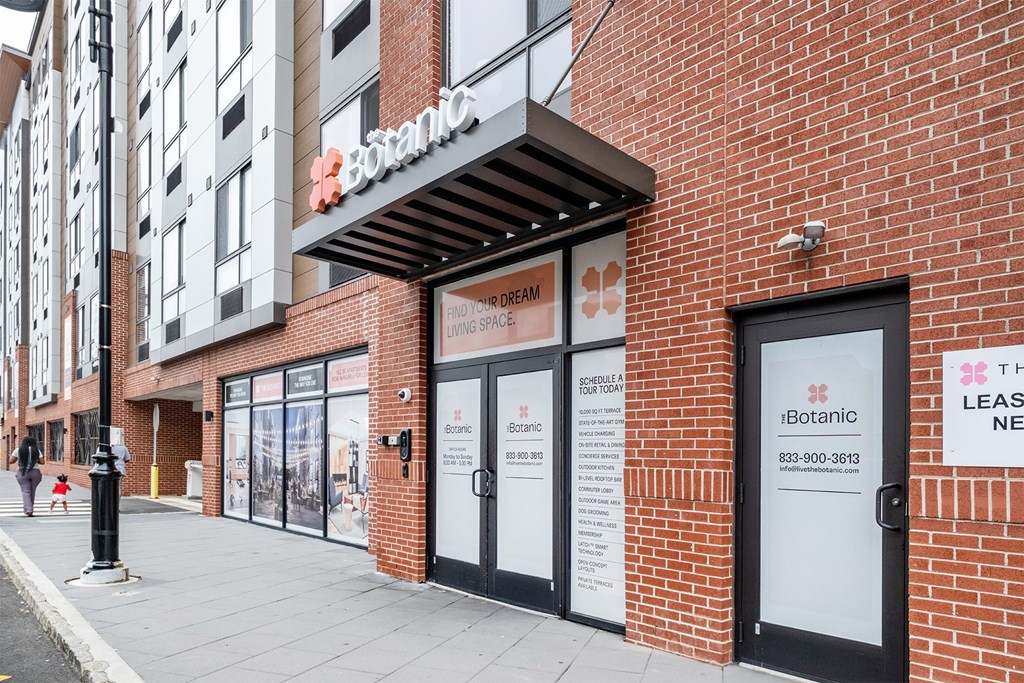 Exterior entrance of The Botanic apartment community in Carteret, NJ