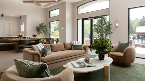A living room with a large couch and a coffee table.
