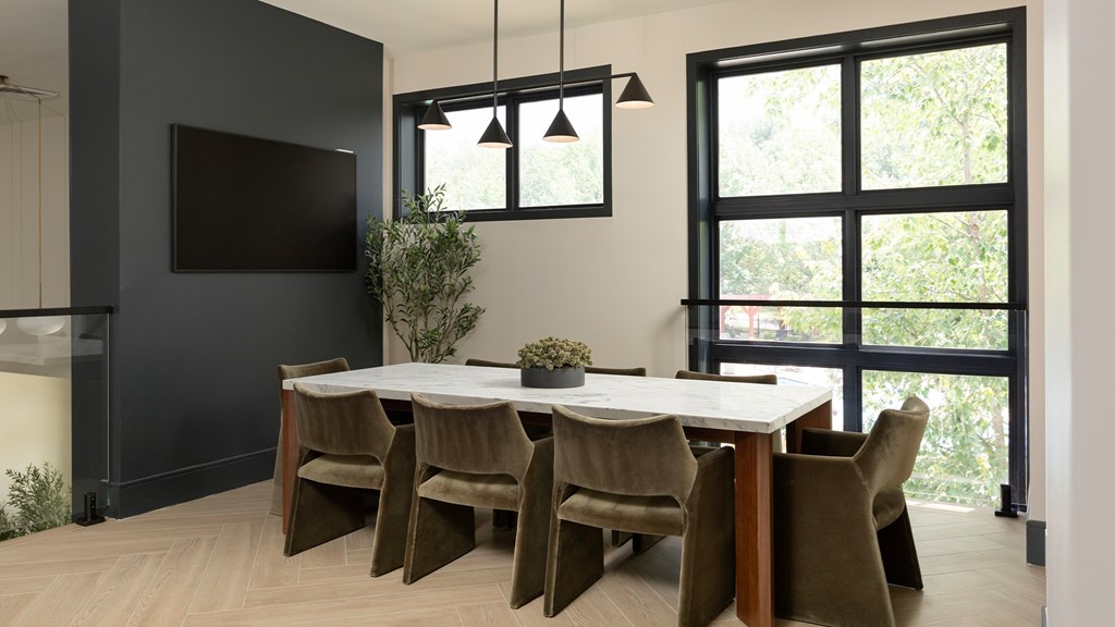 Modern conference room with natural light and stylish seating at The Mews at Princeton Junction, ideal for remote work near Princeton Junction train station.