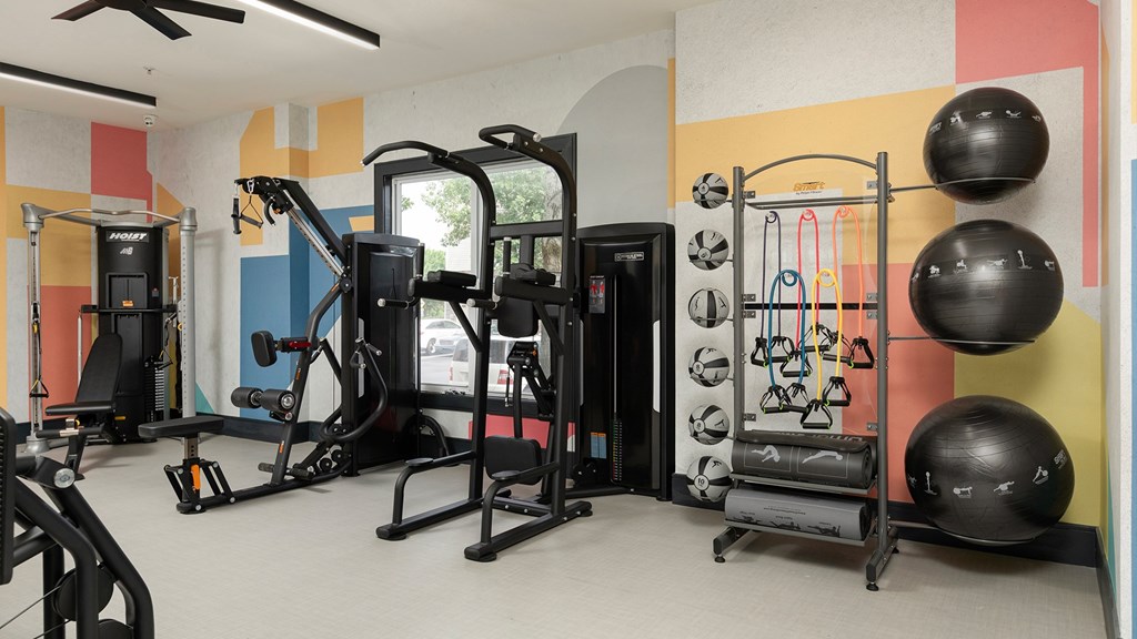 Fully equipped fitness center at The Mews at Princeton Junction featuring strength training equipment and wellness-focused amenities near Princeton Junction.