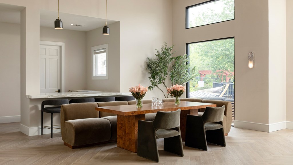 Shared conference table and collaborative amenity space at The Mews at Princeton Junction, designed for professional work and resident use.