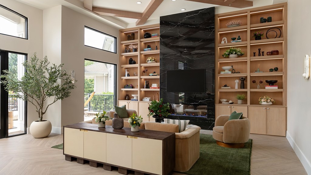 Elegant resident lounge at The Mews at Princeton Junction with natural light and contemporary decor, highlighting move-in ready condos in Princeton.