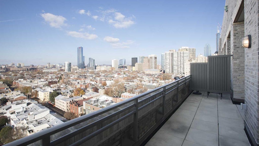 Stunning Philadelphia skyline views from the balcony of The Pepper Building, located in the heart of the Rittenhouse and Graduate Hospital neighborhoods.