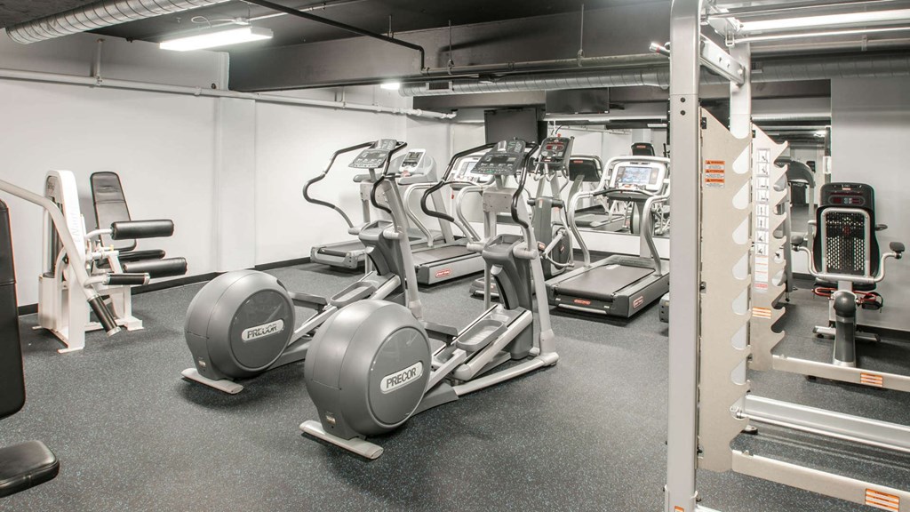 Cardio equipment and weight training machines inside The Pepper Building's fitness center, a premier apartment complex near Fitler Square, Philadelphia.