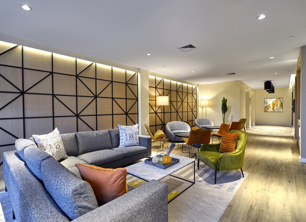 a living room with couches and chairs and a table