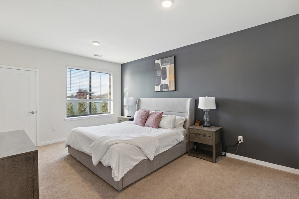 Cozy bedroom with ensuite bathroom at The Lofts at Middlesex