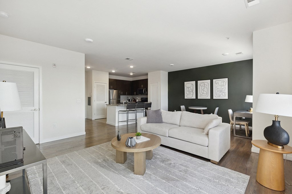 Cozy living room with couch in an apartment rental at The Lofts at Middlesex